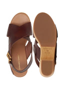 Brown sandals with a visible brand name on a white background