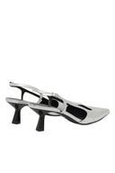 Silver high-heeled shoes on a white background