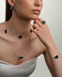 Puzzle Solo Earrings in White Gold and Onyx