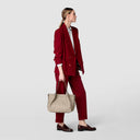 Small Secret bag made from refined Rugiada leather in Sahara tone.